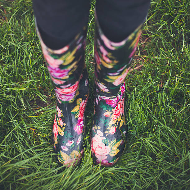 istock Autumn fall concept with green grass and rain boots outside. 492846822
