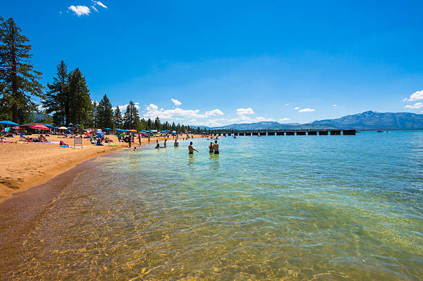 Lake Tahoe, CA, USA - June 14, 2015: People enjoying the day at the beach in Lake Tahoe, CA, USA on June 14, 2015.