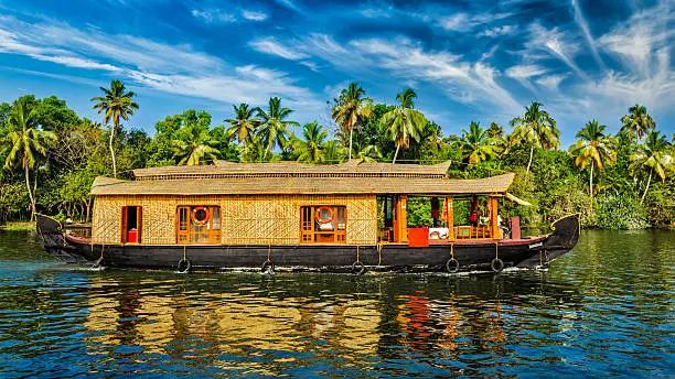 Travel tourism Kerala background - panorama of tourist houseboat on Kerala backwaters. Kerala, India