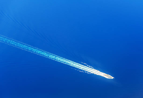 istock Top view on yacht in the blue sea 492853310
