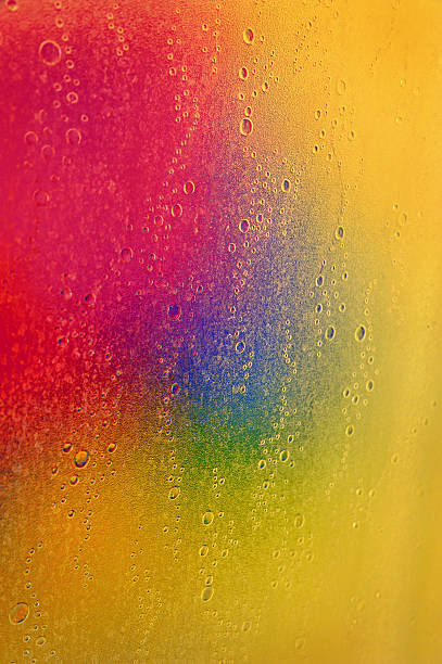 istock Colored background with drops and bubbles on the glass 492853954