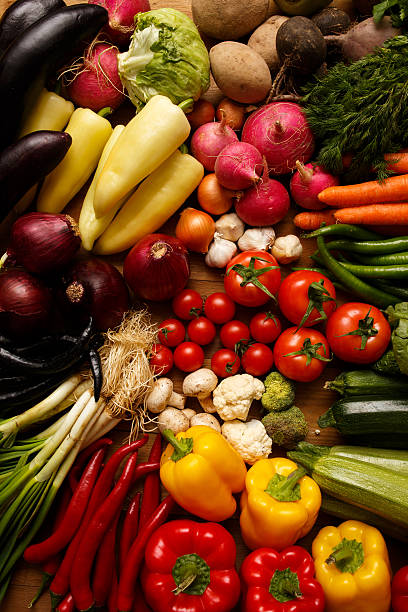 istock Healthy Organic Vegetables on a Wooden Background 492854382