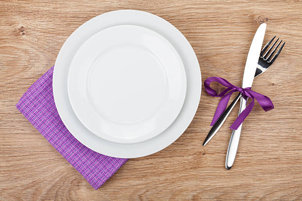 istock Fork with knife, blank plates and napkin 492860689