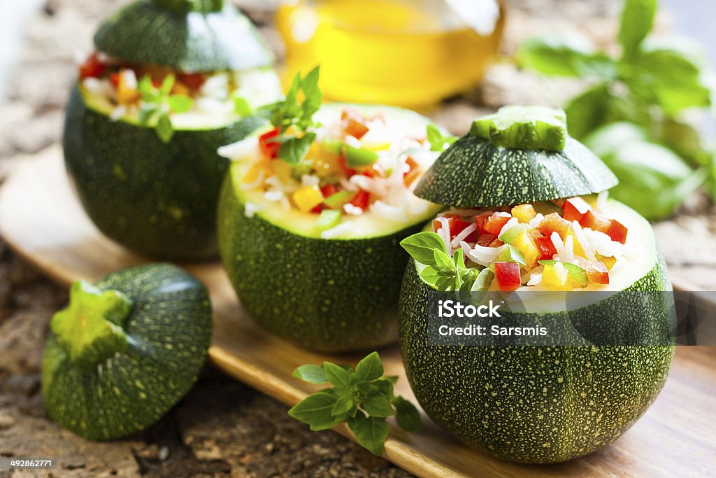 Zucchini stuffed with vegetables Round zucchini stuffed with vegetables and rice Stuffed Stock Photo