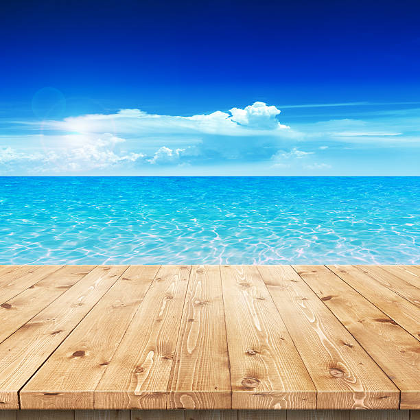 istock Empty wooden table in a sun for product placement or 492864199