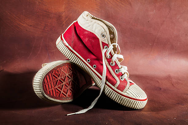 istock old red Sneakers on old Leather. 492864725