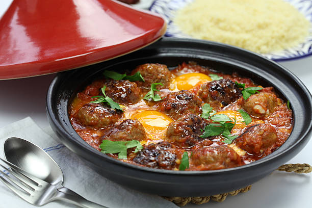 kofta tagine, kefta tagine, moroccan cuisine kofta tajine, kefta tagine, moroccan cuisine, lamb meatballs with eggs tajine stock pictures, royalty-free photos & images