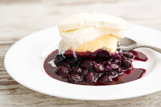 cobbler Blueberry cobbler with ice cream marionberry stock pictures, royalty-free photos & images