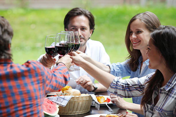 istock Friends clink glasses 492877722