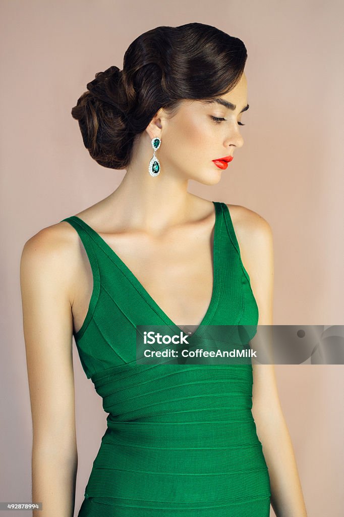 Beautiful woman wearing cocktail dress Beautiful woman wearing cocktail dress. Professional make up and hair style. Women Stock Photo