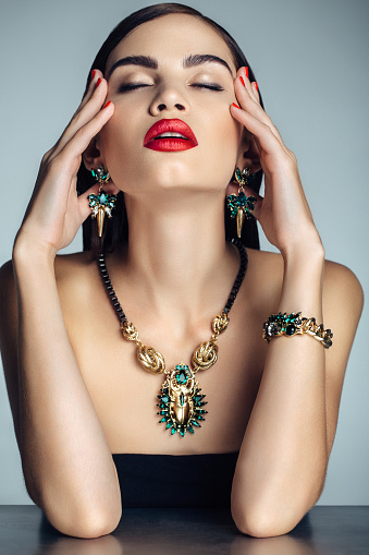 Close-up of a gold chain on a girl's neck.