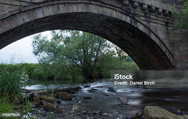 Stream Flowing Under Bridge Stock Photo - Download Image Now - 2015, Beauty In Nature, Bridge - Built Structure