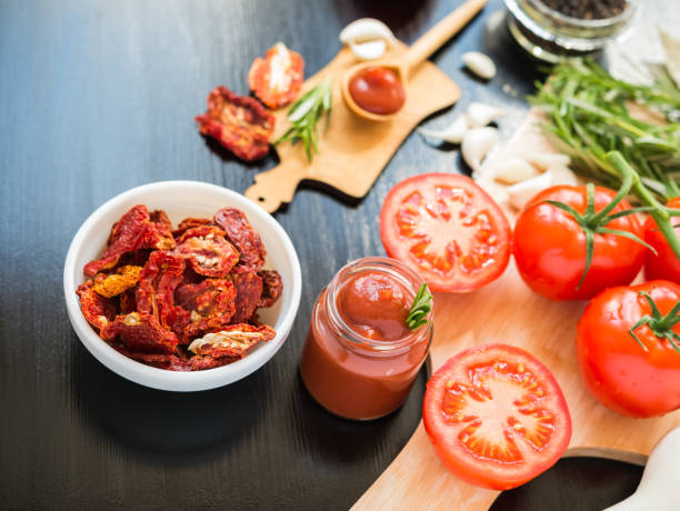 istock Ingredients. Fresh tomatoes, Sun-dried tomatoes, Tomato Sauce and Spices. 492880686