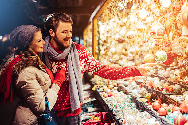 istock Couple shopping at christmas fair. 492881482