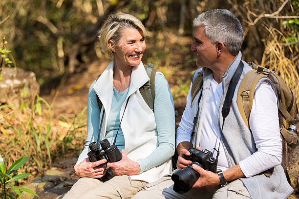 istock middle aged couple resting in mountain valley 492888632
