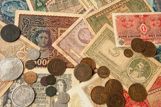 istock old banknotes with antic silver and copper coinsvintage background 492890320