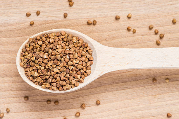 istock Wooden spoon with buckwheat 492893562
