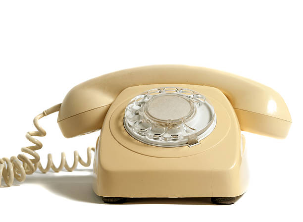 istock Retro yellow phone isolated on white background 492893616