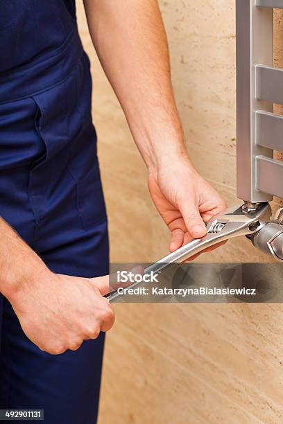Repairing Heater Stock Photo - Download Image Now - Adult, Appliance, Blue-collar Worker