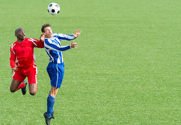 istock Two Footballers In Action 492901687