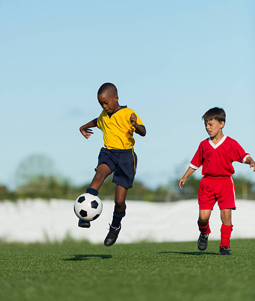 istock Two Young Boys Playing Football 492902061