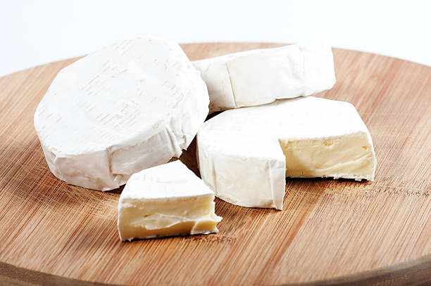 istock few pieces of cheese on a wooden board 492903629