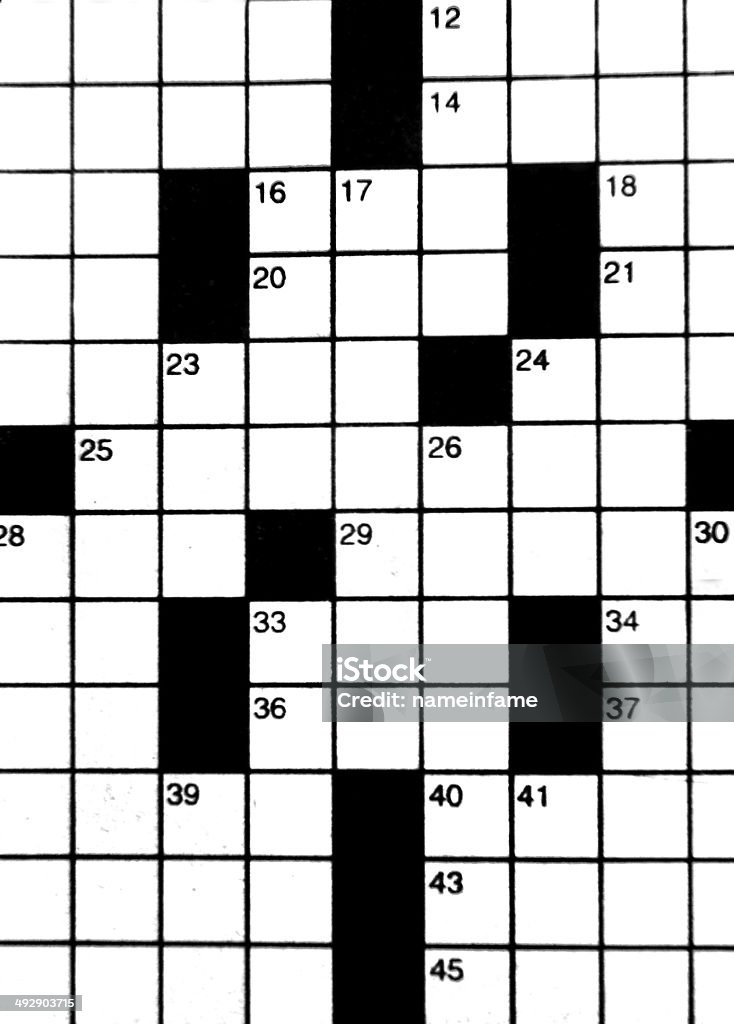 Blanks on Crossword Puzzle Crossword puzzle fills background image.  Blanks with corresponding numbers and clues challenge the mind. Backgrounds Stock Photo