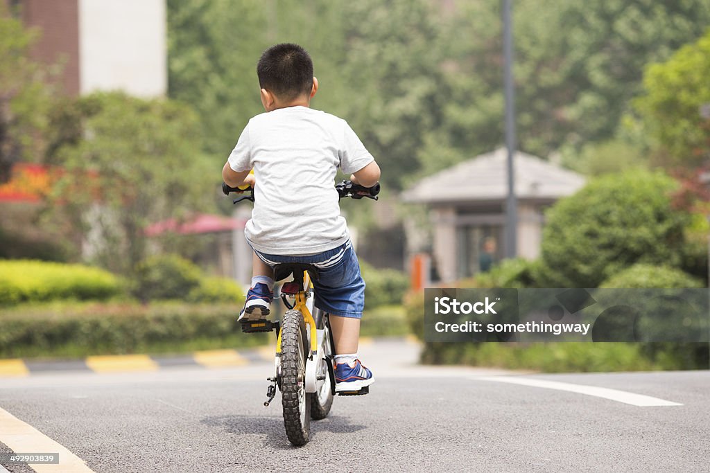 schoolboy on a bicycle residential area in a quiet Child Stock Photo
