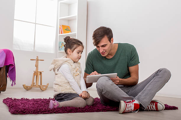 istock Father and daughter with a tablet 492903899