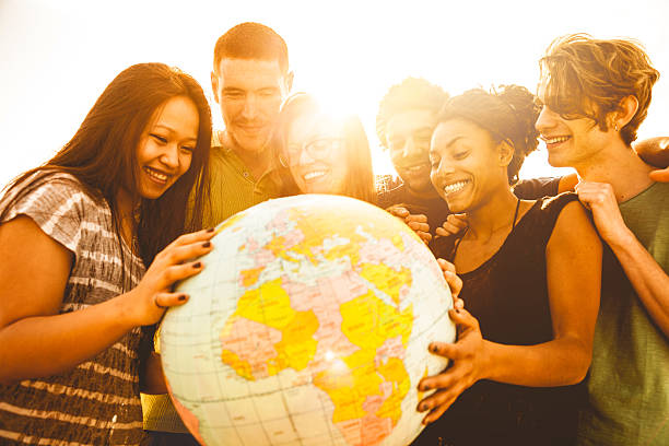 istock Group of friends holding an earth globe 492904499