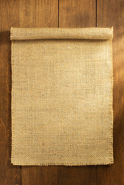 istock burlap hessian sacking on wooden 492906346