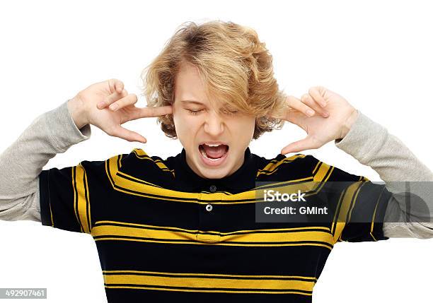 Portrait Of Furious Teenage Boy Screaming Stock Photo - Download Image Now - Adolescence, Anger, Attitude