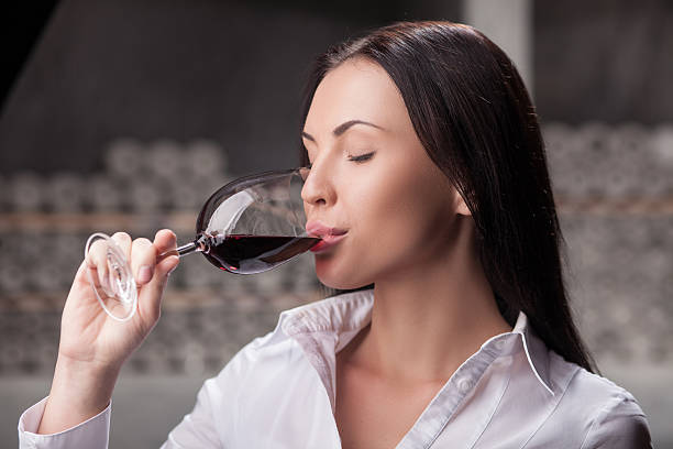 istock Attractive lady is tasting alcohol drink in storage 492907622