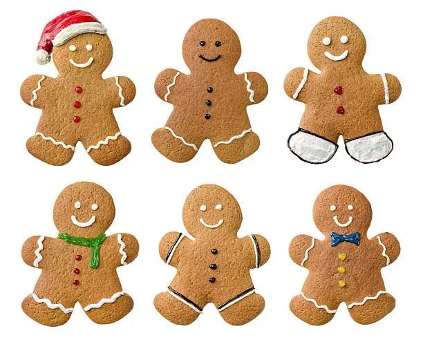Photo of Collection of various gingerbread men on a white background