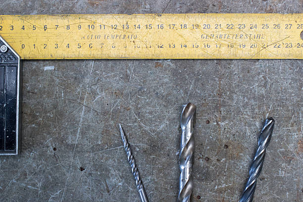 istock Meter and drills on the old wooden desk 492911406