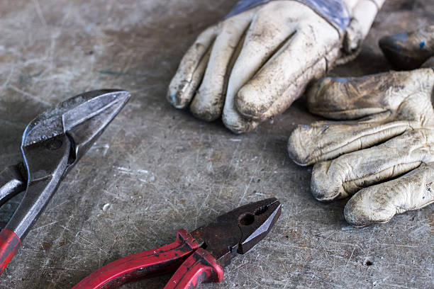 istock Scissors and a pair of gloves on the desk 492911580