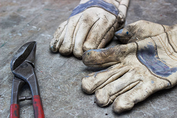 istock Scissors and a pair of gloves on the desk 492911630