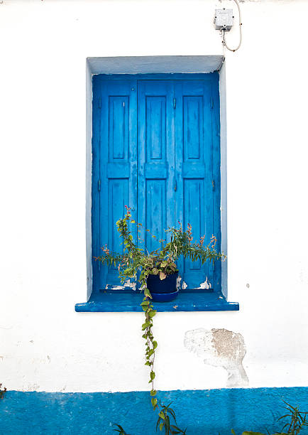 Greek house with blue window