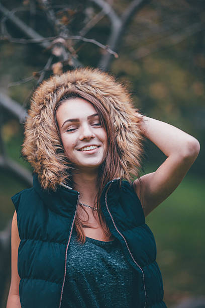 istock Young pretty girl standing near the tree. 492912378