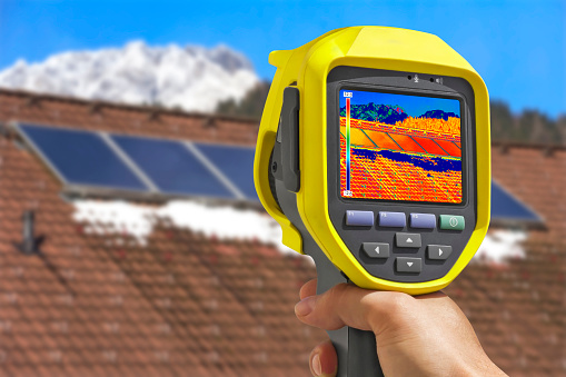 Recording Photovoltaic Solar Panels on the roof House With Thermal Camera