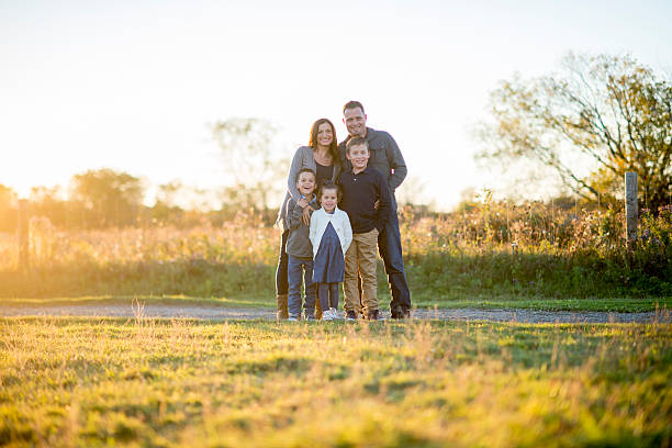 istock Family Standing in Their Front Yard 492933748