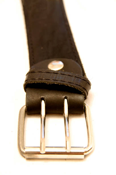 istock Black leather belt isolated on the white background 492935286