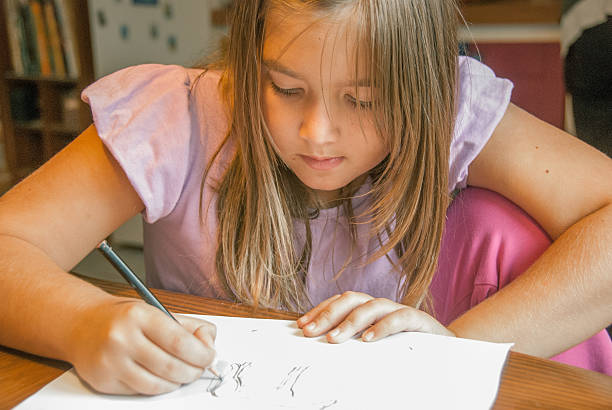istock Little Girl Drawing 492937692
