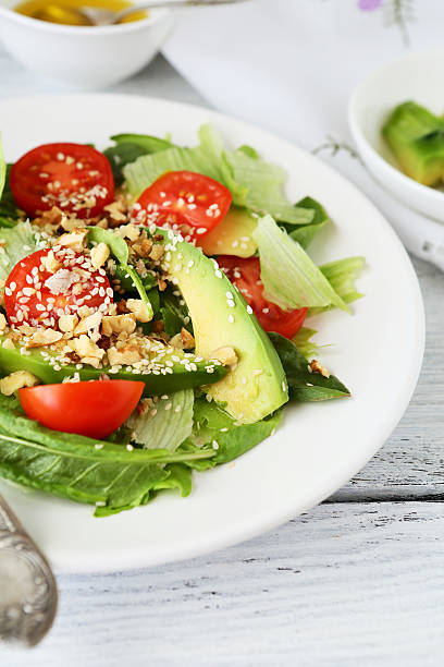 istock fresh salad with slices of avocado 492937940