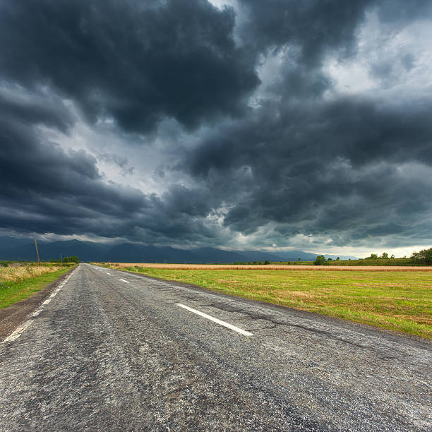 istock Driving on an empty asphalt road at storm 492939046