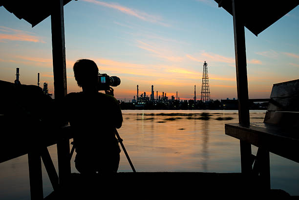 istock Silhouette of camera man is taking a picture. 492939444