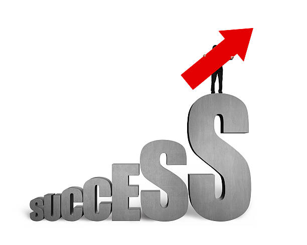 istock Man holding arrow up on dollar sign success text stairs 492940134