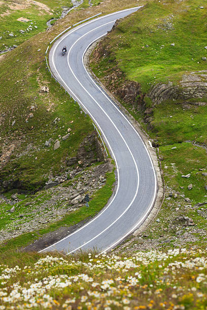 istock Riding a motorcycle on mountain winding road 492941146
