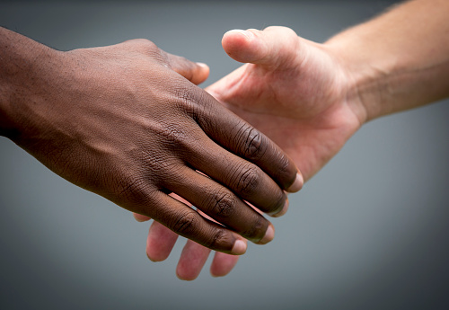 partnership, helping hands,friends, handshake between europe and africa