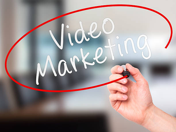 istock Man Hand writing Video Marketing black marker on visual screen 492941700
